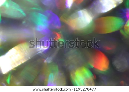 Rays rainbow.Blurred abstract creative background. Rainbow background. Lens flare. Colorful bokeh light. Illuminated burst of multicolor light. Lights of the night and evening city. Blurred circles.