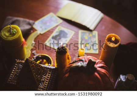  Mystical atmosphere, view of tarot card on the table, esoteric concept, fortune telling and predictions. 