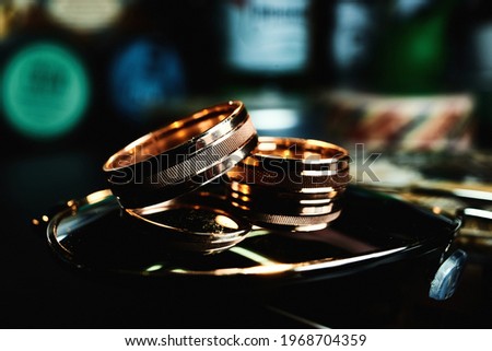 Wedding gold rings on brown background. Preparing for the wedding. Close-up, macro