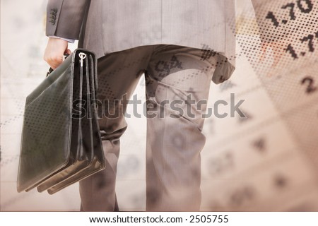 close-up of financial paper and businessman rushing