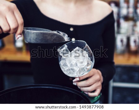 Similar – Image, Stock Photo Woman adding ice in splashing cocktail