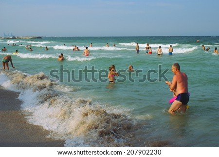 THE BLACK SEA AT EFORIE NORD,ROMANIA - JULY 27, 2014. People at the Black Sea, at the Eforie Nord  resort , in Romania.