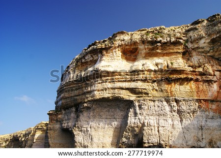 GOZO ISLAND, MALTESE ISLANDS ,EUROPE - NOVEMBER 5, 2014. Force of the nature. Amazing rock formation seen from a boat trip at famous Azure Window, Dwejra cave in Gozo Island, Malta