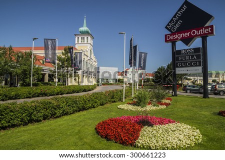 VIENNA, AUSTRIA - JULY 11, 2015. Parndorf Designer Outlet  - MCARTHUR GLEN OUTLET MALL ,exterior view of the outlet ,with 150 designer and fashion shops , on the road which links Vienna to Budapest.