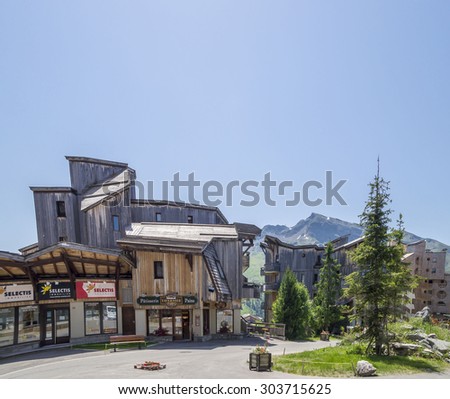 AVORIAZ , FRANCE - JULY 7, 2015. Strange wooden  buildings in  Avoriaz , French mountain resort, in the middle of the Porte du Soleil , Alps Mountains.