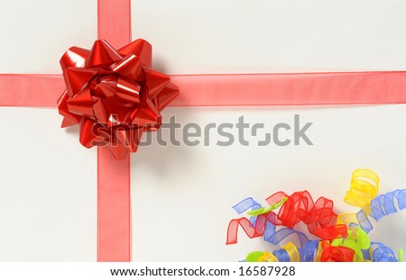 white box with red ribbon and bow
