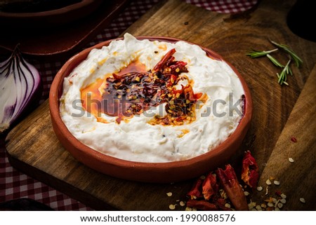 Traditional Turkish and Greek Meze with chili peppers. Turkish Appetizer Atom with yogurt. Turkish atom meze
