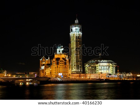Russia. Moscow. View on music hall and the Kosmodamianskaya quay across Moskva river at night