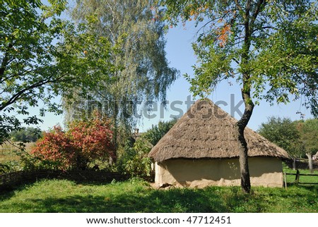 Ukraine. Kiev. White Clay House With A Thatch Against A Background Of ...