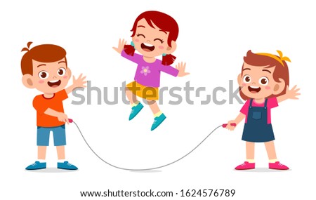 happy cute kids boy and girls play jump rope