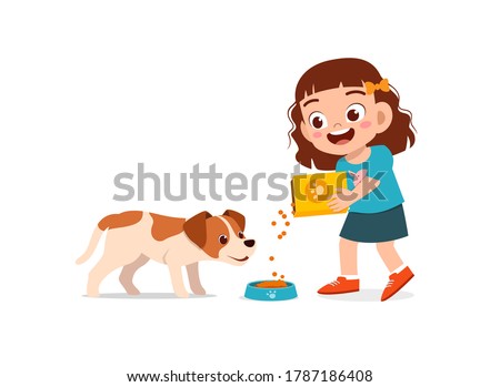 happy cute little kid play with dog