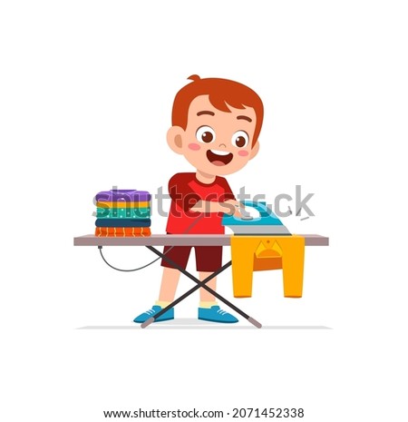 little boy use electric iron to smooth clothes