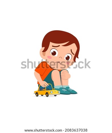 cute boy play toy car alone and feel sad