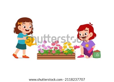 cute little girl stand and watering flower