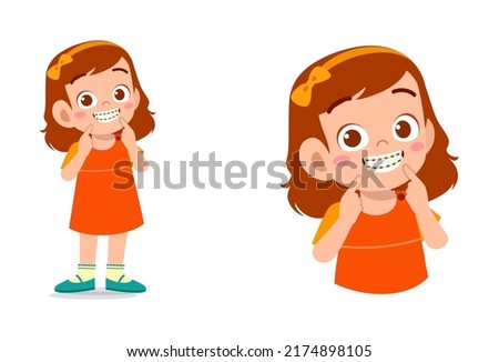 little kid using dental braces and feel happy