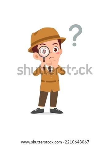 little kid wearing detective costume and holding magnifying glass