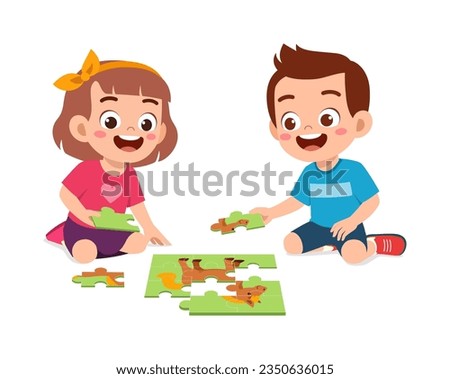 little kid play puzzle with friend and feels happy