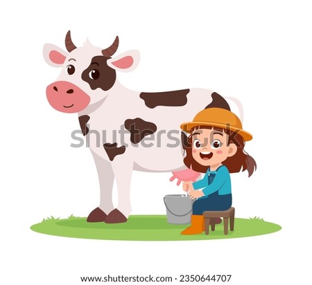 little kid milking cow and feel happy