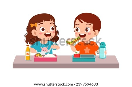 little kid having lunch with friend in school