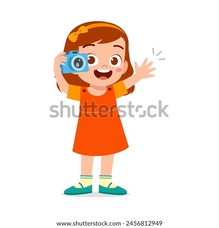 little kid holding camera and take photo