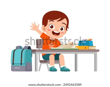 little kid study on desk and raise hand to answer question