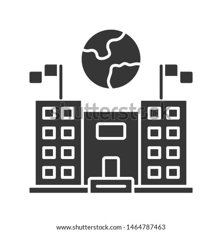 Immigration center glyph icon. Embassy and consulate building. Administrative governmental structure. Earth globe over public building. Silhouette symbol. Negative space. Vector isolated illustration