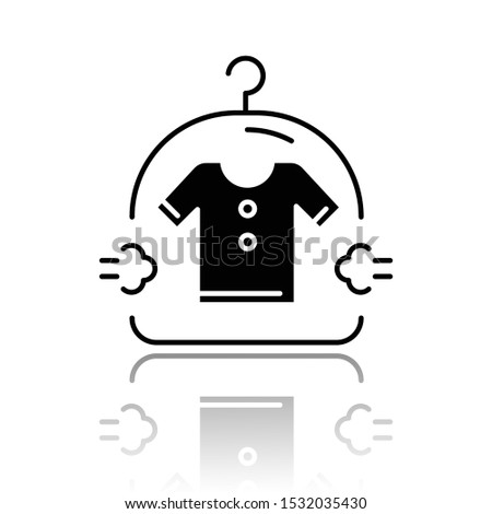 Dry cleaning service drop shadow black glyph icon. Laundry. Clothes washing, drying amenity. Vector isolated illustration