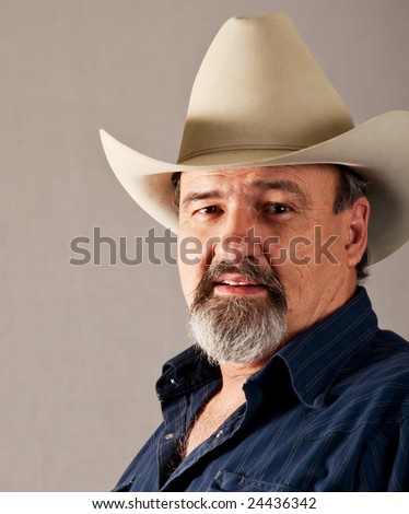 A Rugged Old Cowboy Takes A Break From His Busy Day. Stock Photo ...