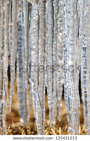 number of natural icicles on mountain background
