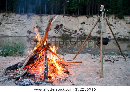 campfire on the beach on the shore of Lake