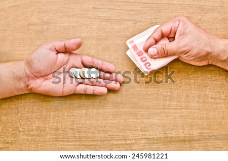 money exchange (hand giving coin to change with banknote in another hand)