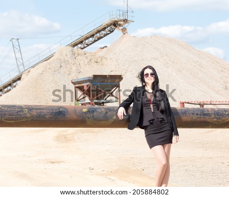 business jet set woman at industrial arabian building