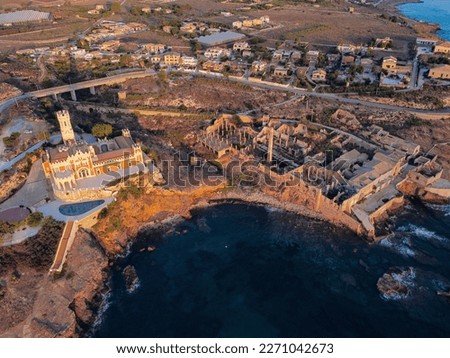 Aerial drone. Rocky coastline and island at Portopalo di Capo Passero, Siracusa Province, Sicily. Stok fotoğraf © 