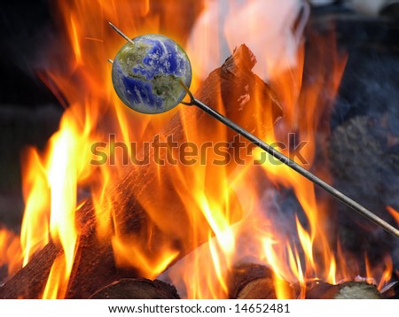 Ecological concept: The Earth on a metal fork fried on bonefire