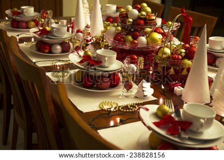 christmas eve table setting with ornaments, new year eve table setting