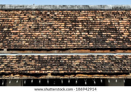 Old brick roof tiles of a Temple in Thailand