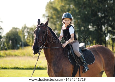 Similar – Foto Bild Kleines Mädchen reitet Pferd auf dem Hippodrom