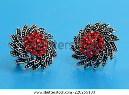silver jewelry with red stones inside