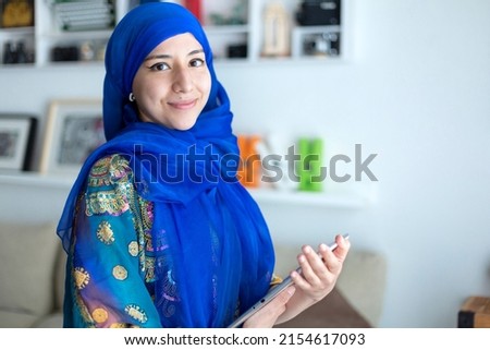 Similar – Image, Stock Photo Persian woman at home while looking through the window