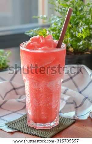 Fruit punch frappe on a decorative background
