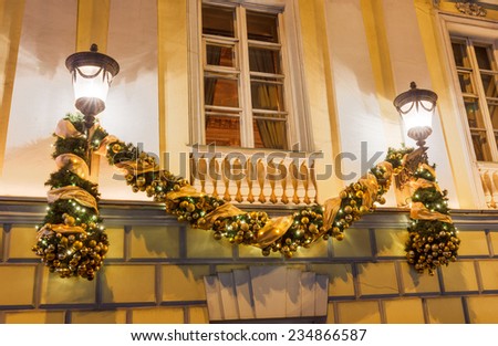New Year and a Christmas lights decoration on the old town house. Moscow, a fragment of the facade of the old mansion on Tverskoy Boulevard