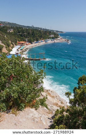 Landscape sea coast with beach in summer sunny hot day. Crimea, South Beach, a beach on the beach in Semeize