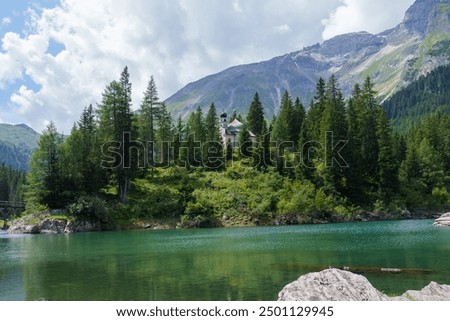 Image, Stock Photo 1600 | Mountain lake with clouds hanging low in the mountain