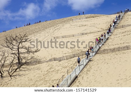 PYLA SUR MER, FRANCE - AUGUST 8: People visiting the Famous dune of Pyla, the highest sand dune in Europe, on August 8, 2012 in Pyla Sur Mer, France.