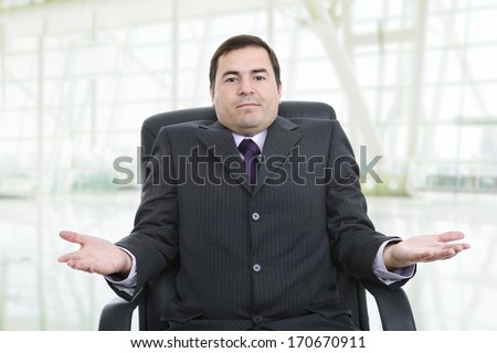 young business man on a office chair, at the office