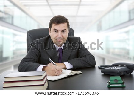 businessman writing on a desk at the office