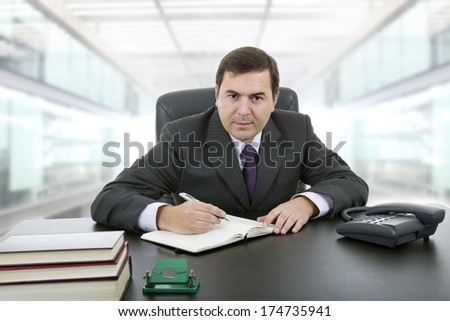 businessman writing on a desk at the office