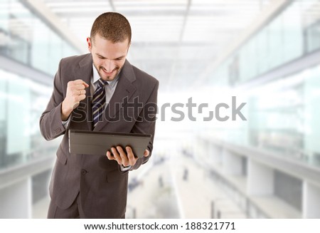 businessman happy using touch pad of tablet pc, at the office