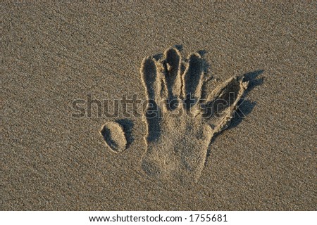 hand print on the sand
