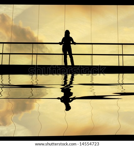 woman in the modern building at sunset